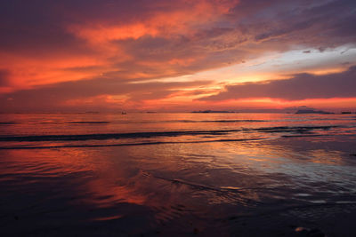 Scenic view of sea against orange sky