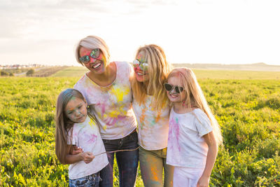 Women wearing sunglasses on field