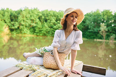 Portrait of woman sitting on bench