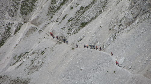 High angle view of people hiking on mountain