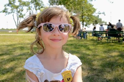 Portrait of smiling girl wearing sunglasses