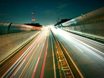 High angle view of light trails on road at night