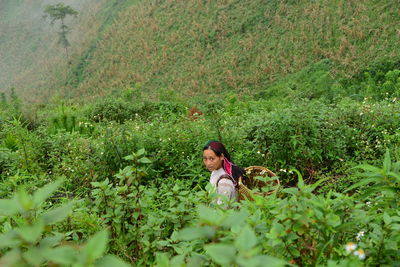 Woman standing on field