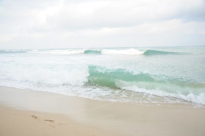 Scenic view of beach against sky