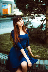 Young woman sitting outdoors