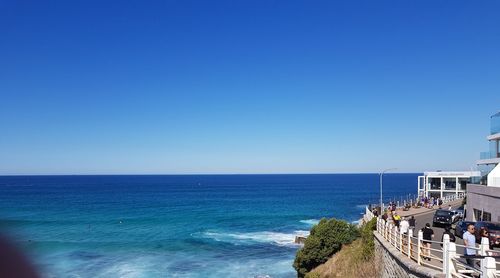 Scenic view of sea against clear blue sky