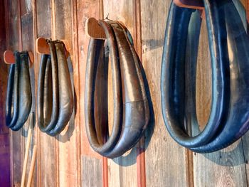 Close-up of old clothes hanging on wood