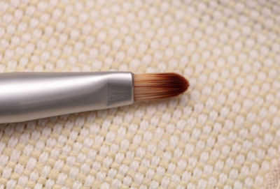 Close up of make-up brush on table