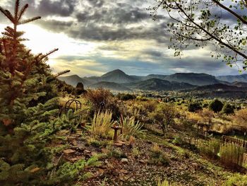 Scenic view of mountains against cloudy sky