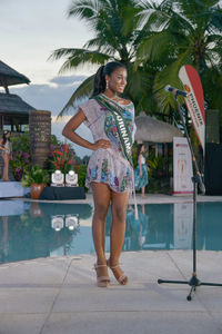 Full length of woman standing in swimming pool