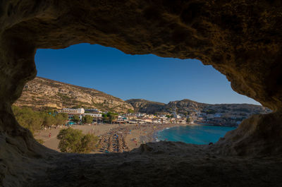 Scenic view of sea and buildings against sky