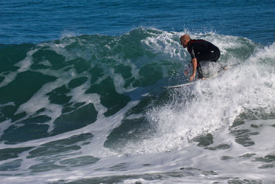 Man surfing in sea