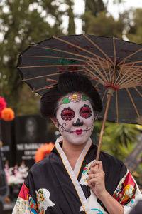 Portrait of woman with umbrella