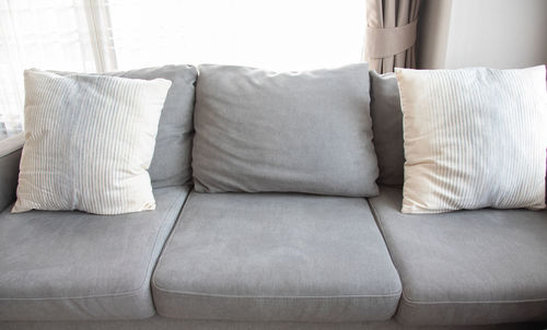 Close-up of sofa on bed at home