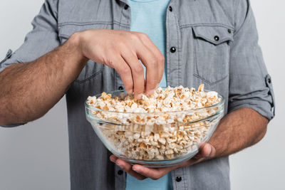 Midsection of man holding ice cream