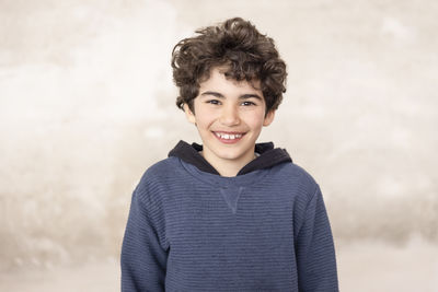 Portrait of smiling boy at recycling center