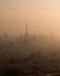 Cityscape against sky during sunset