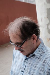 Close-up of man wearing eyeglasses