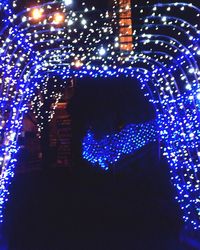 Low angle view of illuminated lamp post at night