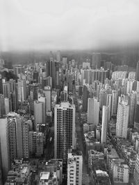 Aerial view of modern buildings in city against sky