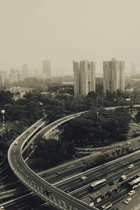 High angle view of modern buildings in city against sky