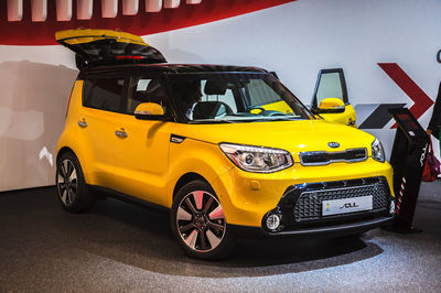 Yellow toy car on road