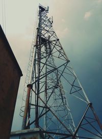 Low angle view of building against cloudy sky