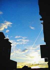 Low angle view of buildings against blue sky