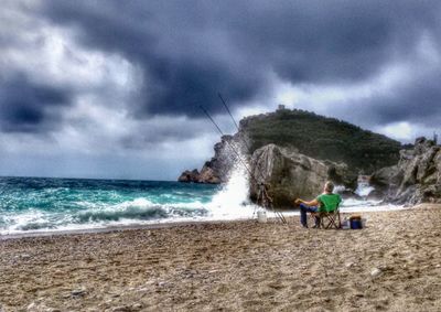 Scenic view of sea against cloudy sky