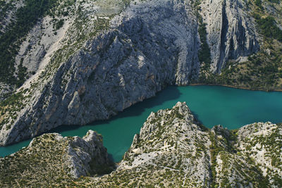 High angle view of lake amidst rocks