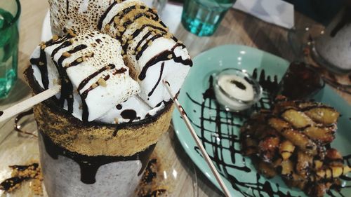 High angle view of desserts on table