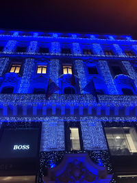 Low angle view of illuminated building at night