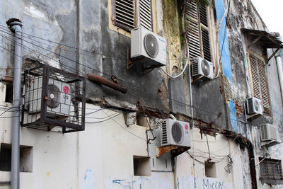 Low angle view of clothes drying on old building