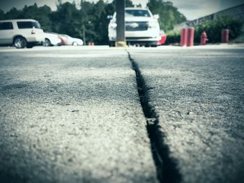 Close-up of car on road