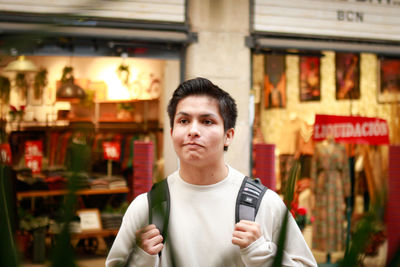 Portrait of young man standing outdoors