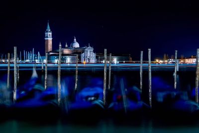 Reflection of illuminated buildings in water at night