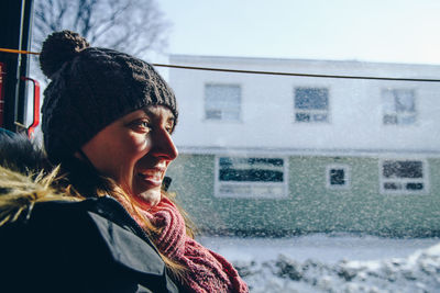 Woman traveling in bus during winter