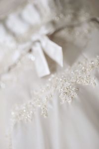 Close-up of designs on wedding dress