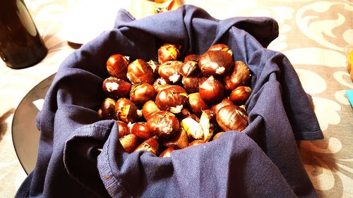 Close-up of chestnuts on bed at home