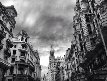 Low angle view of building against cloudy sky