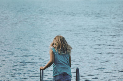 Rear view of woman looking at sea