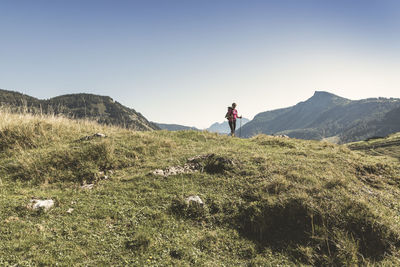 Woman hiking on mountain