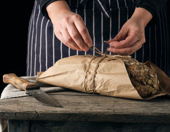 Close-up of man preparing food on cutting board