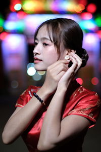 Portrait of beautiful asian woman wearing red dress in chinese new year festival.