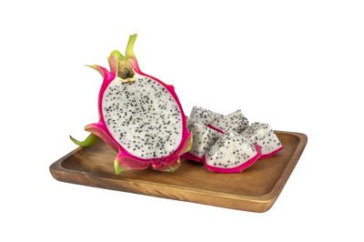 Close-up of fruits on table against white background