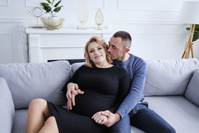 Loving couple rejoices in pregnancy expecting a baby