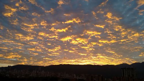 Scenic view of cloudy sky at sunset