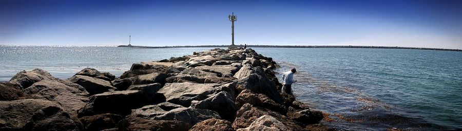 Panoramic view of sea against clear sky