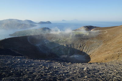 Aerial view of volcanic landscape against sky