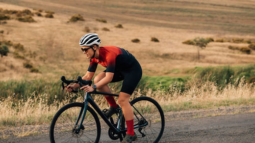 Man riding bicycle on road